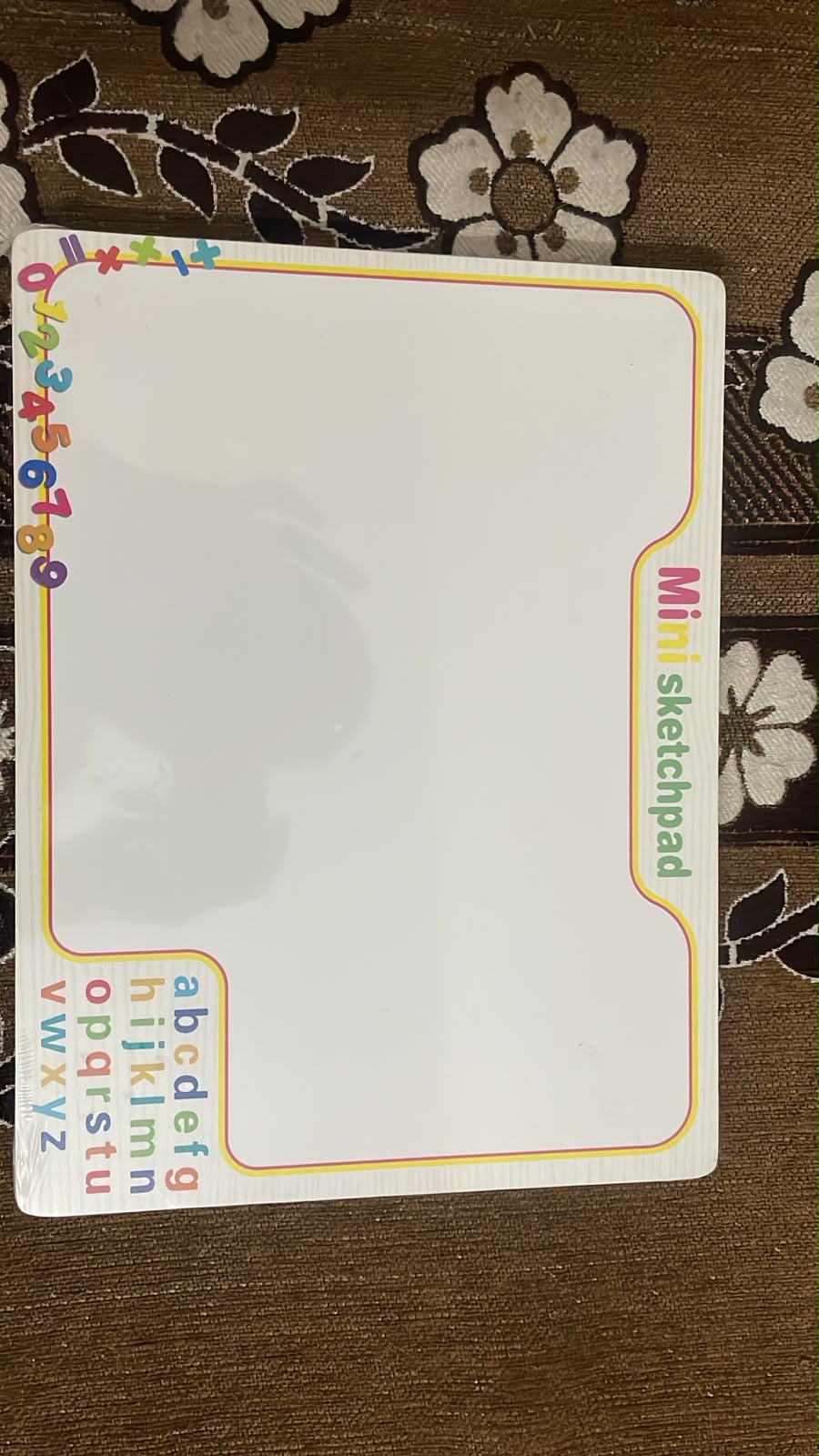 Lifestyle image of a child using the wooden fruit puzzle board to improve gripping skills, hand-eye coordination, and focus through hands-on play.