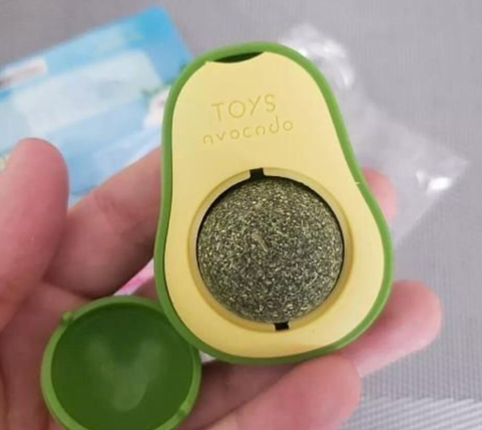 Baby And Fur Catnip Lick Ball held in hand showing size and texture – compact and durable cat dental toy