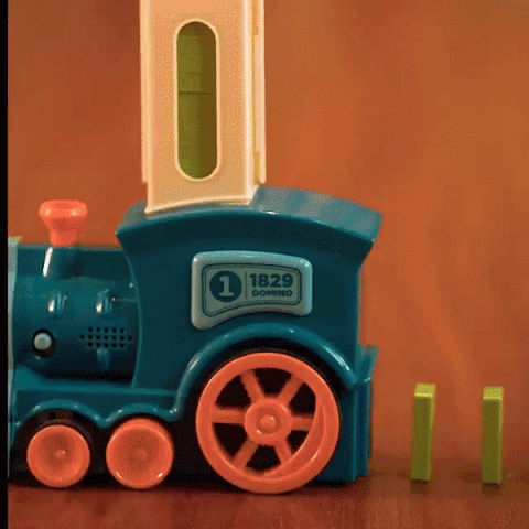 Flat lay of Baby and Fur domino train toy packaging showing all parts neatly arranged