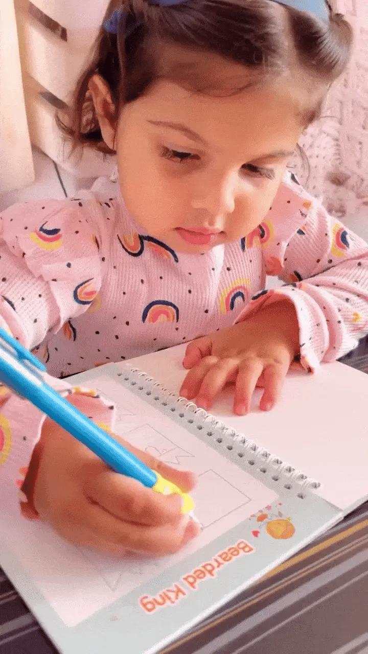Reusable handwriting practice book from Baby and Fur featuring evaporative ink pen and soft silicone grip for correct pen-holding posture.