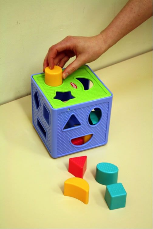 Parent and child engaging in learning play with Baby And Fur geometric shape sorter puzzle box