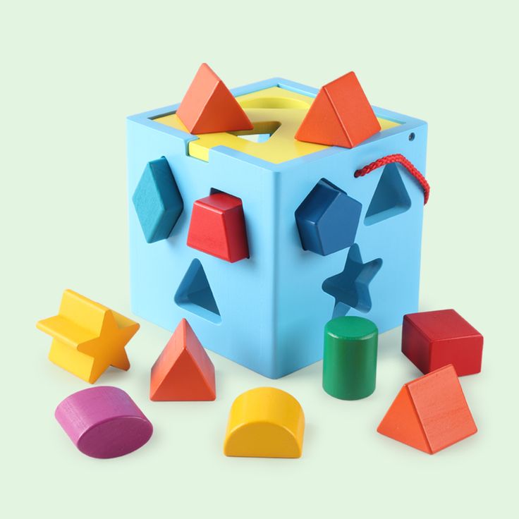 Child inserting colorful blocks into Baby And Fur shape sorting cube educational toy