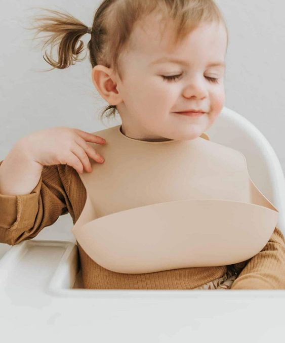 Baby and Fur waterproof food catcher pocket bib that builds early eating habits, confidence, and structured feeding routines